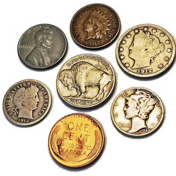 Assorted vintage U.S. coins including Indian Head penny, Buffalo nickel, Mercury dime, and Barber coins